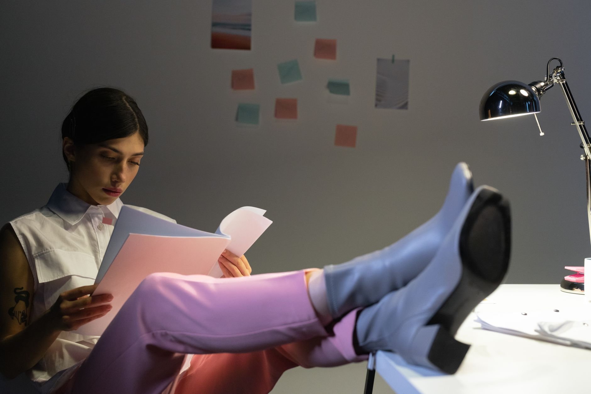 Creative professional working at desk in warm editorial light